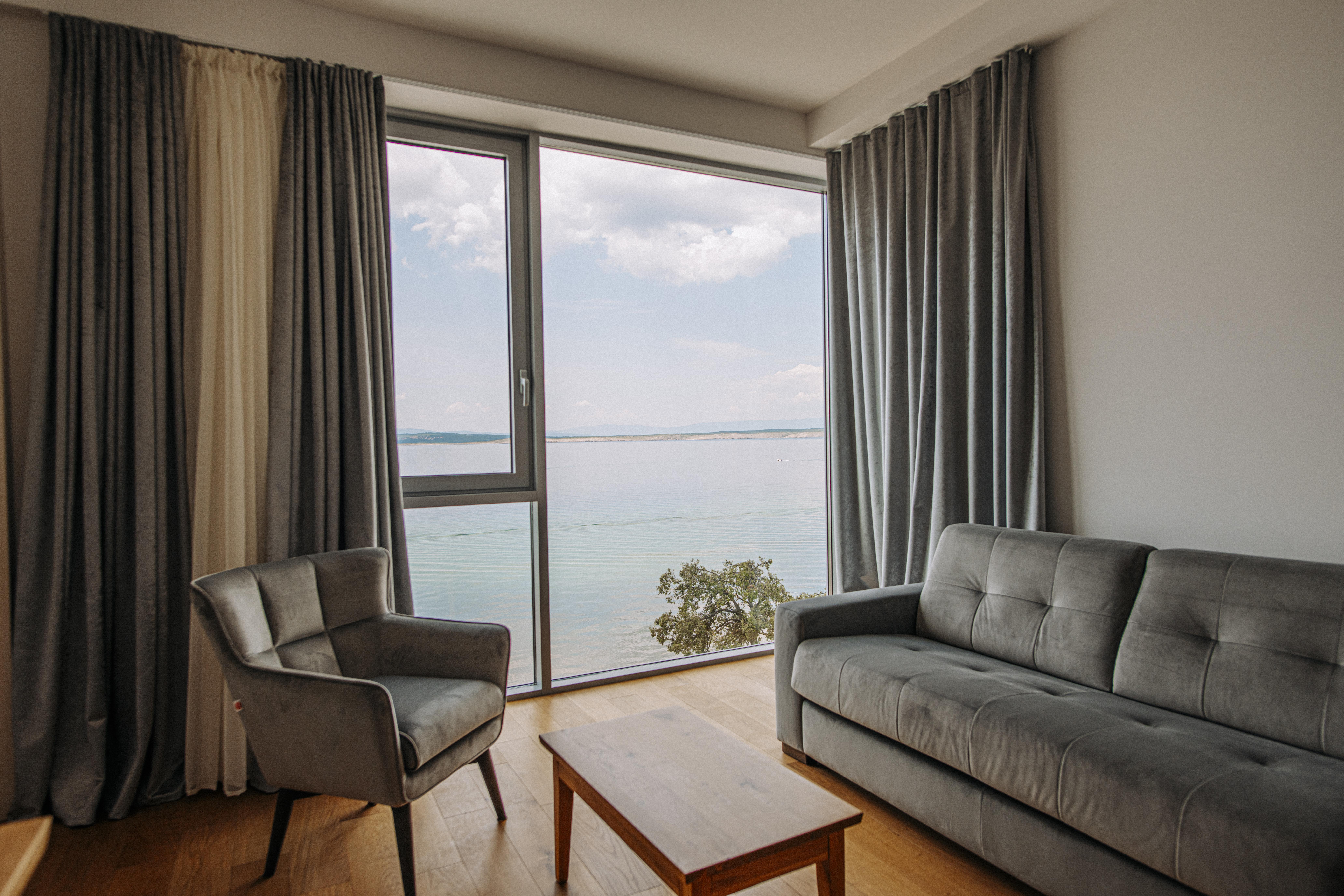 Hotel Miramare Crikvenica Exterior foto A living room with curtains